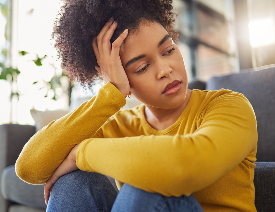 Tired woman with PCOS looking away